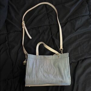 Jean blue, cream and gold purse.